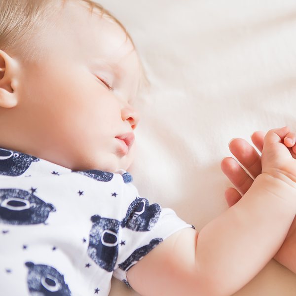 Peaceful baby sleeping on a bed